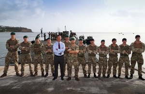 Mark Lancaster poses with the crew of RFA Mounts Bay after watching a Humanitarian Relief and Disaster Relief Exercise on the small volcanic island of Montserrat.